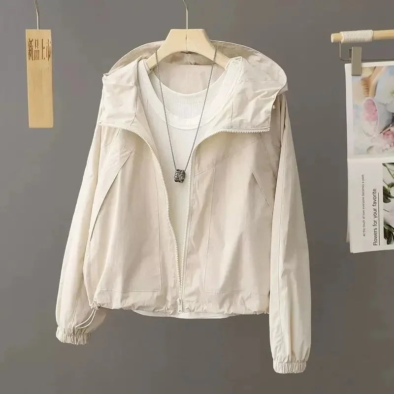 Sun-proof, lightweight, and stylish. This sheer, hooded jacket provides effortless sun protection and breathability.