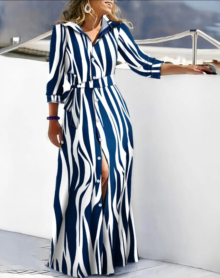 The dress that defines your spring. Elegant, flowy, and versatile, this maxi shirt dress with a waist tie enhances your silhouette with style. Perfect for any occasion, from casual to more sophisticated.