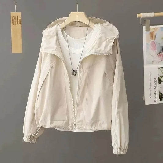 Sun-proof, lightweight, and stylish. This sheer, hooded jacket provides effortless sun protection and breathability.
